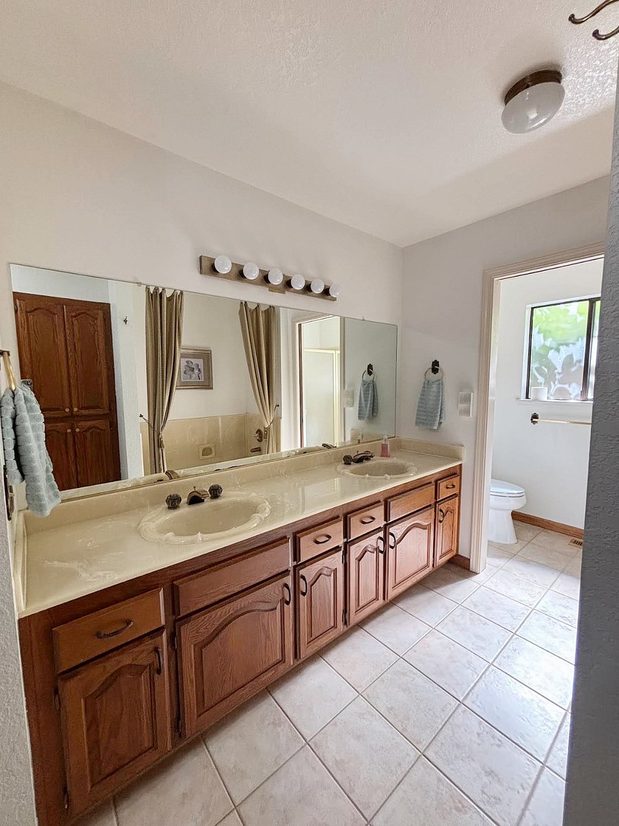Loads of cabinet space in the primary bathroom. Separate shower and bathtub.