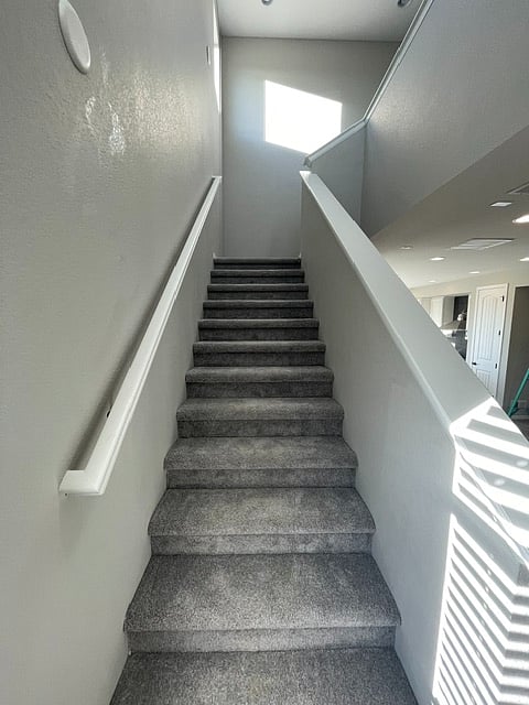 Stairs leading to the bedrooms & laundry. 