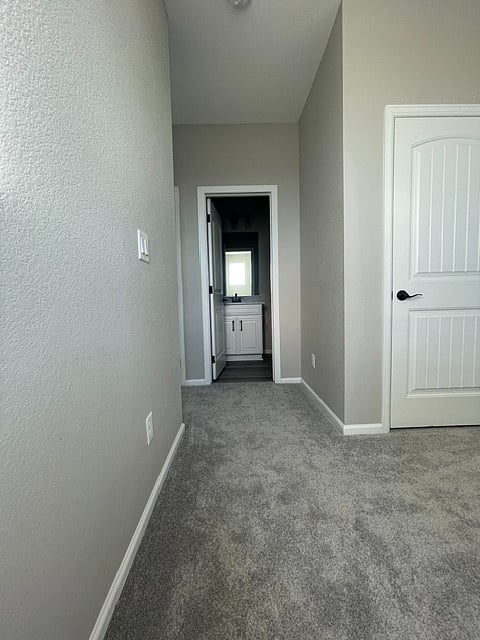 Top of stairs.  Bedroom 2 is to the right; turning left down a short hallway is Bedroom 3 and the Master Bedroom and connected bathroom are at the end. 