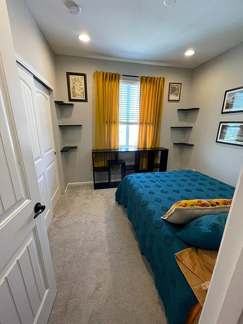 Standard size closet which has been upgraded to include container store drawers, shoe rack, and shelving. 