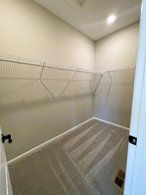 Walk-in closet in master bedroom. 