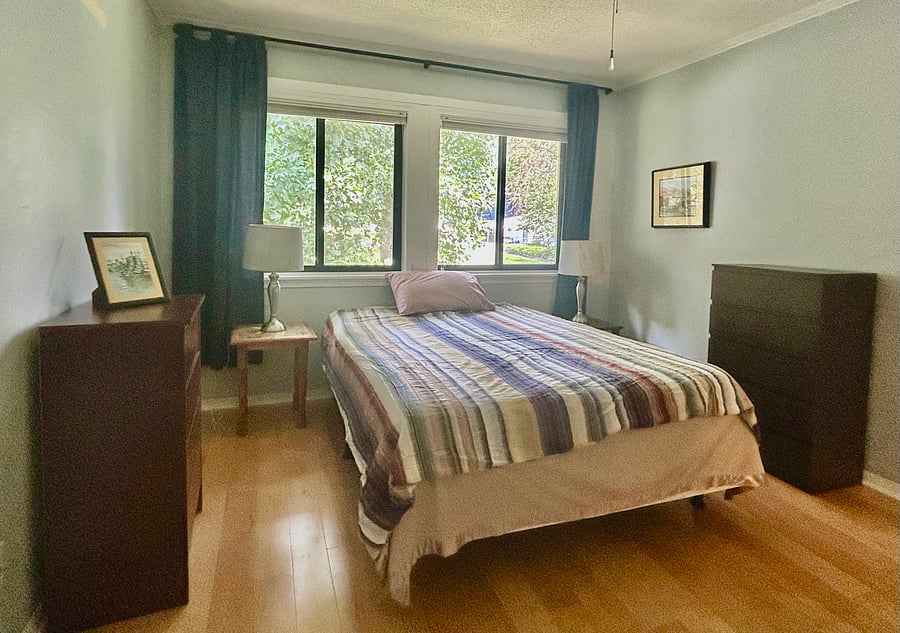 Main bedroom with blackout curtains.