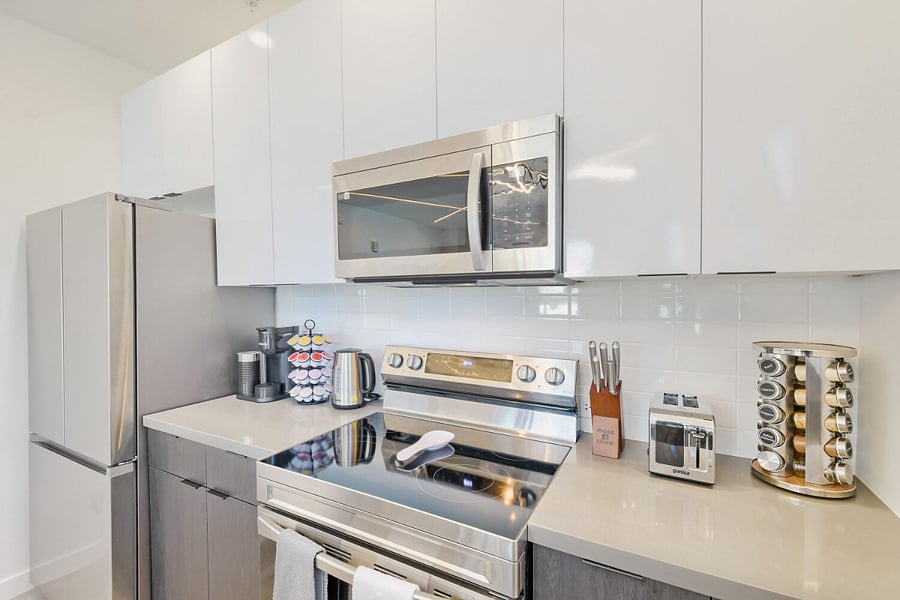 Kitchen with Coffee Maker, Microwave,Refrigerator, Stove, Over, Toaster, and Kettle