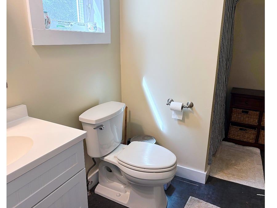Private bathroom featuring shower with rainfall head