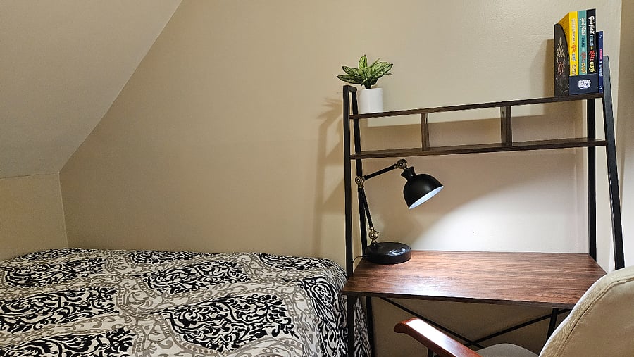 South queen bedroom with dedicated workspace and seating