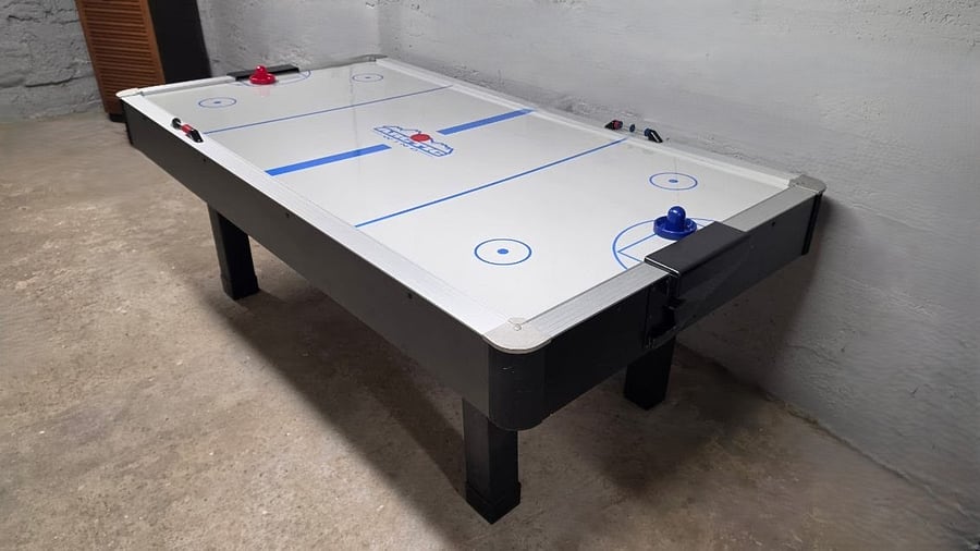 Air hockey table for family fun and friendly competition.
