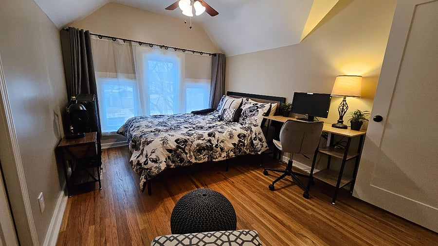 Upstairs front queen bedroom with workspace