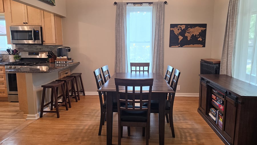 Dining area with natural light and direct connection to the kitchen and living spaces.