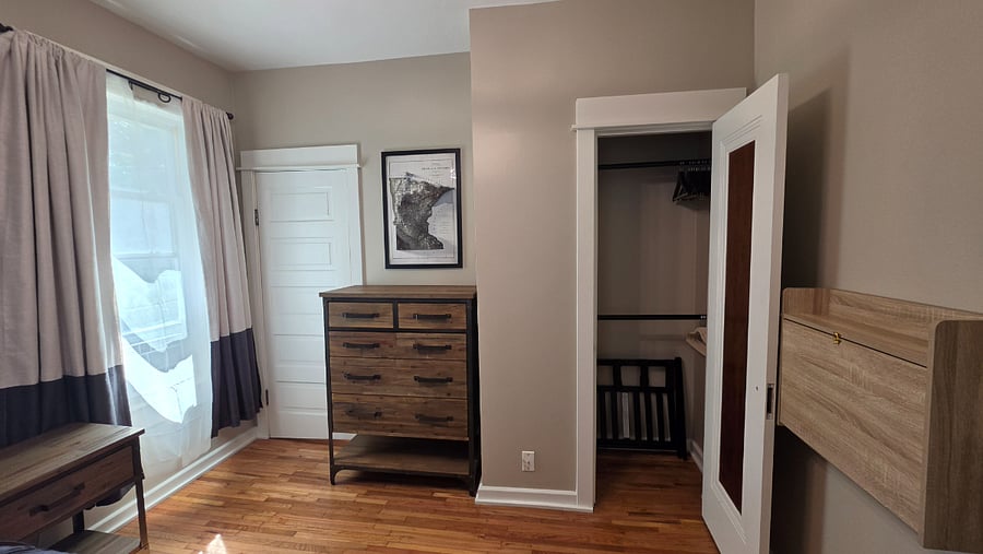 Dresser and closet storage (& luggage rack) provide room to settle in during longer stays..