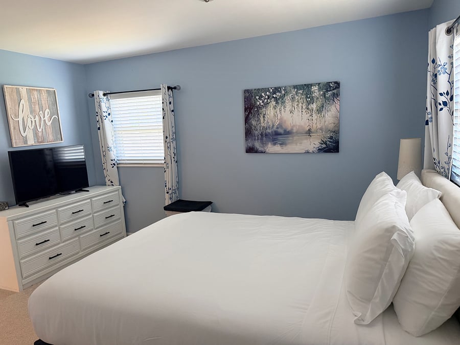 Primary bedroom with 42 Smart TV