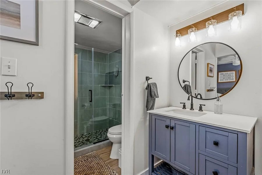 Primary bedroom's bathroom has modern shower (now with heated bidet toilet).