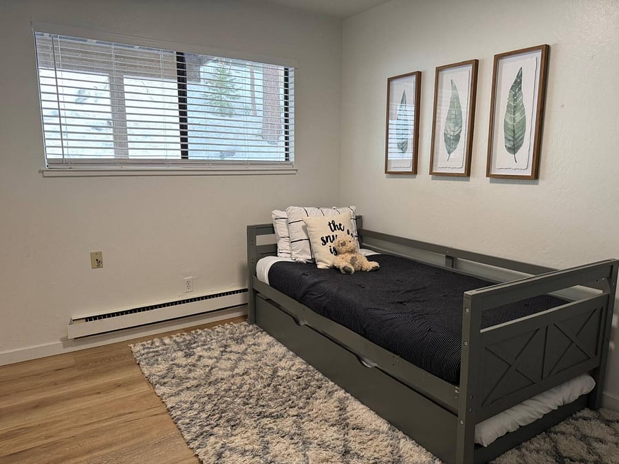Third bedroom has trundle bed with twin mattresses and shared bathroom, closet area to the right.