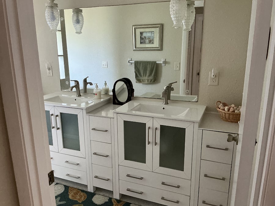 Bathroom with tub and double sink