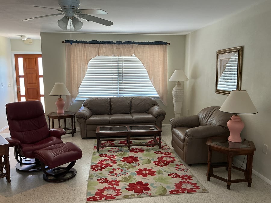 Living room with front entrance door.