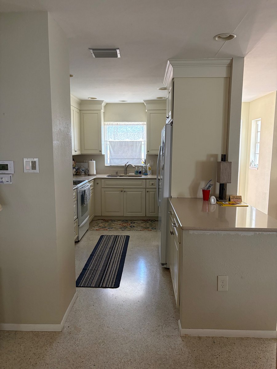 Kitchen sink with range and refrigerator
