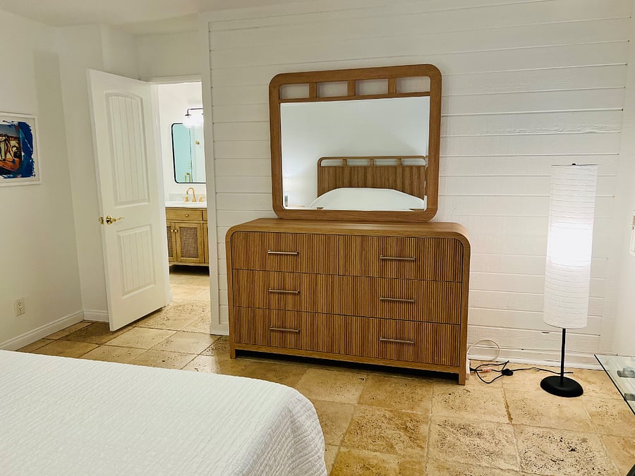 Primary bedroom chest of drawers with mirror