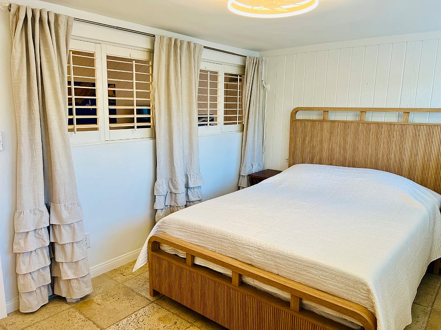 Guest bedroom can have shutters left open with curtains open or they can be shut off from the living room