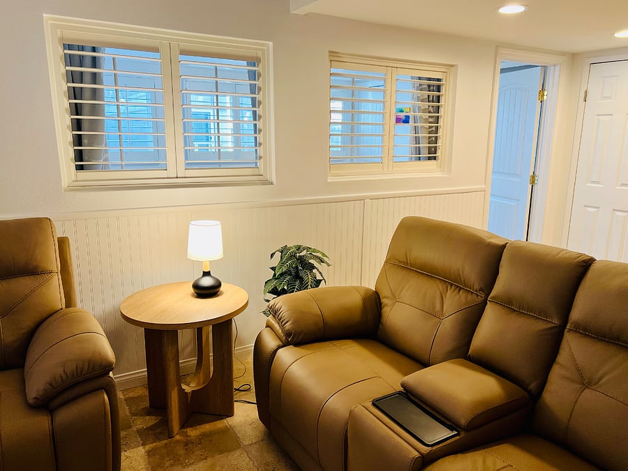 View from living room into second bedroom/office through shutters...and you can see outside windows in this photo as well
