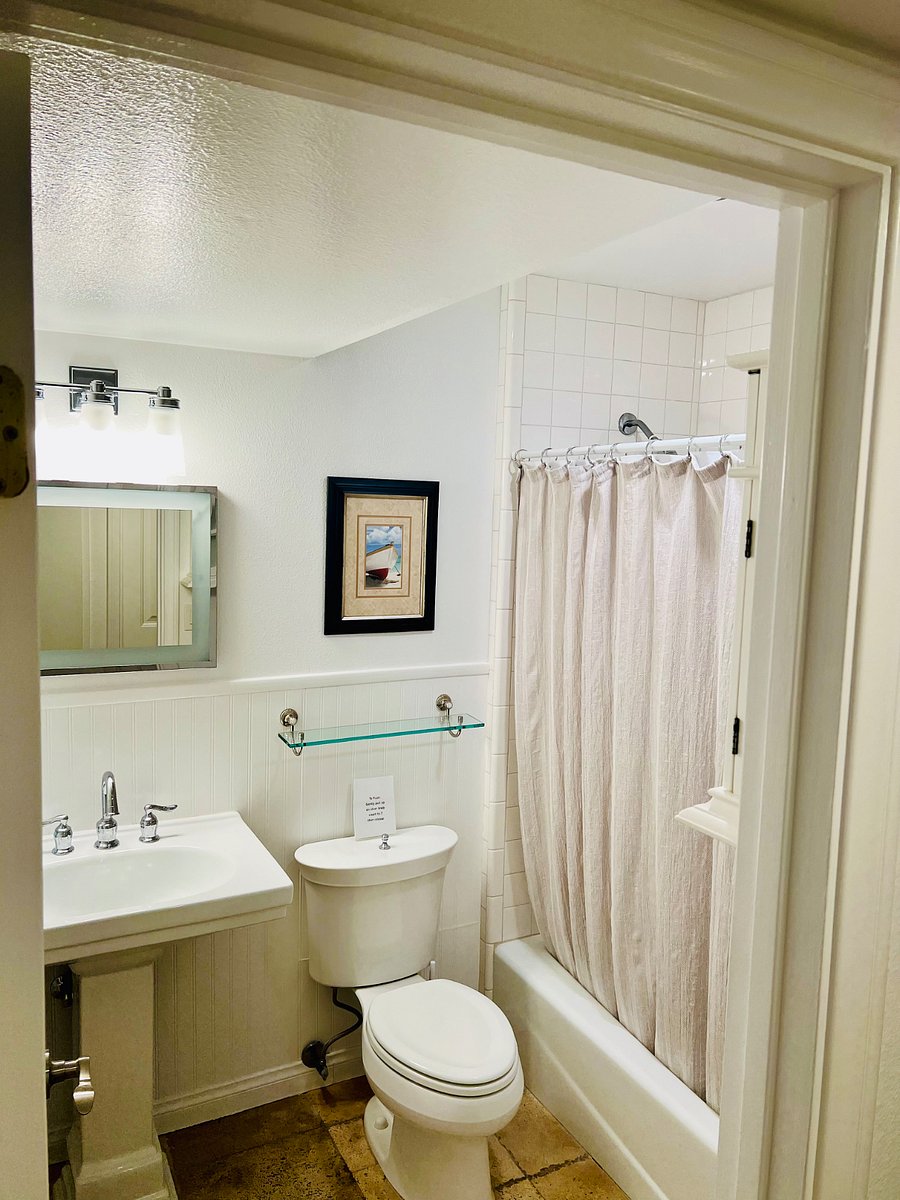 Guest bathroom which is off the hallway serving the majority of the condo as well