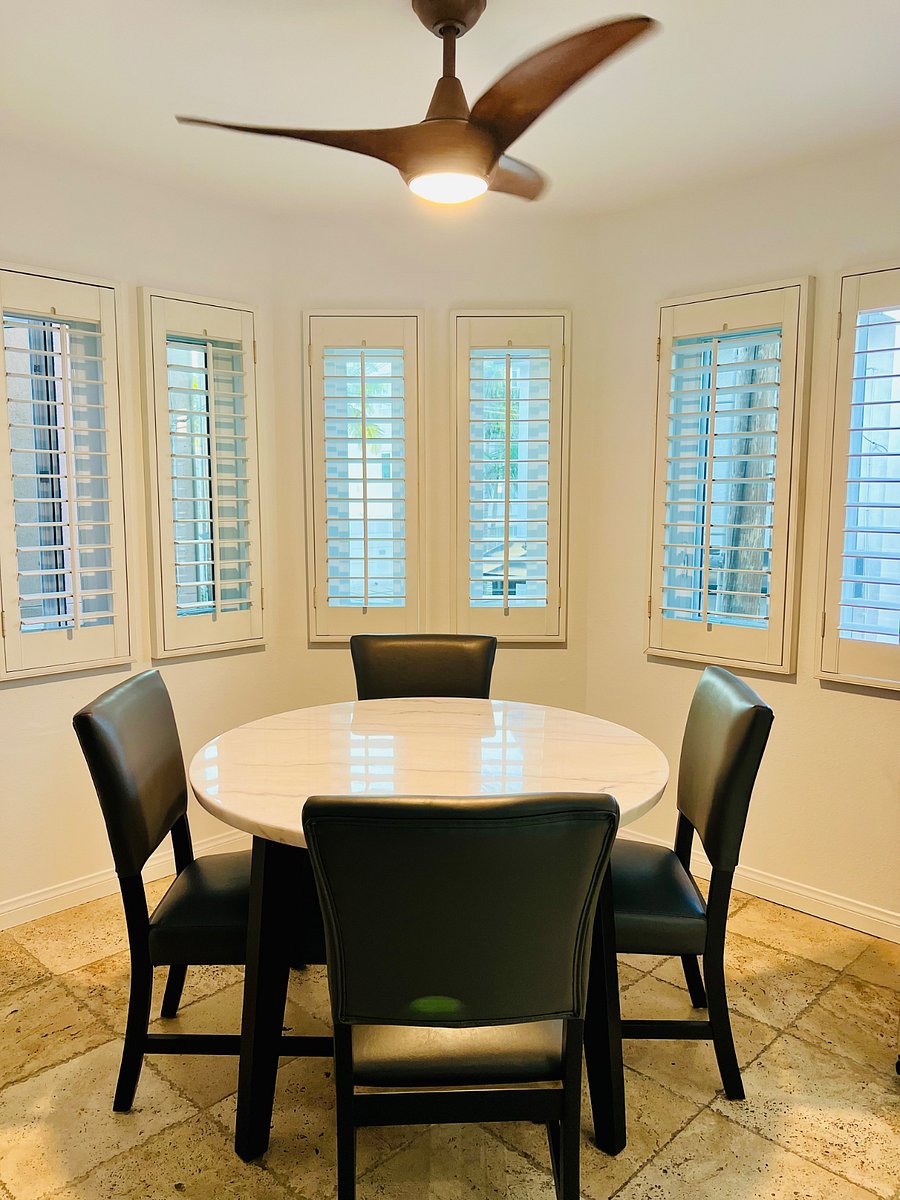 Kitchen table seats 4 and overlooks the back and side of the house