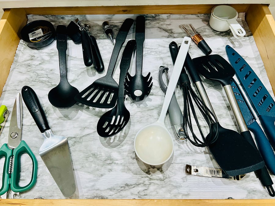 Lots of cookware and knives