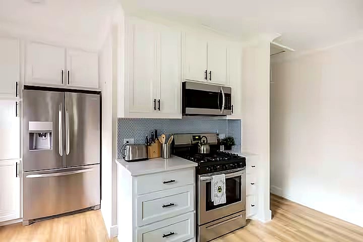Spacious kitchen stocked with cooking basics, sharp knives, cookware, coffee maker, toaster, and everyday essentials. Modern appliances and plenty of counter space make it easy to prepare meals during your stay.