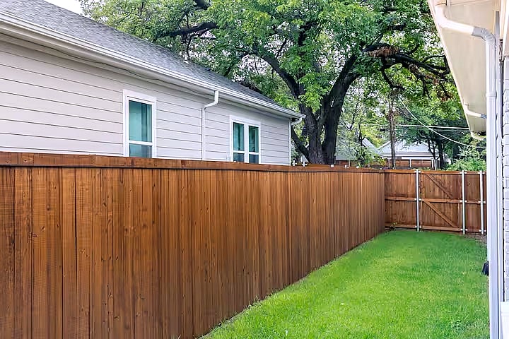 Private side yard with direct access to the kitchenperfect for morning coffee, outdoor dining, grilling, or letting your pup enjoy the fresh air in a fully fenced space.