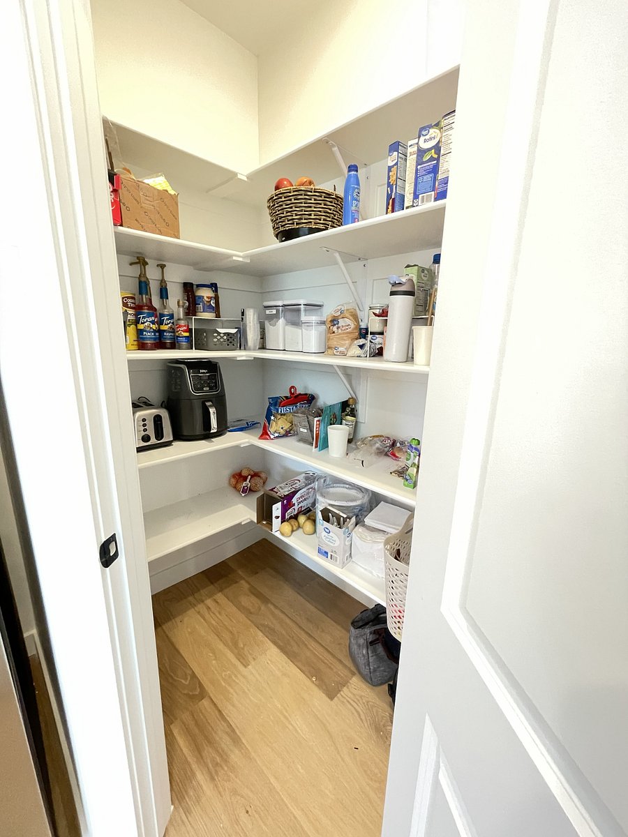 spacious pantry including appliances and beverage station