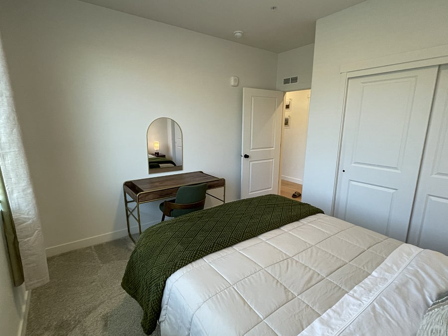 Bedroom one including a workstation.