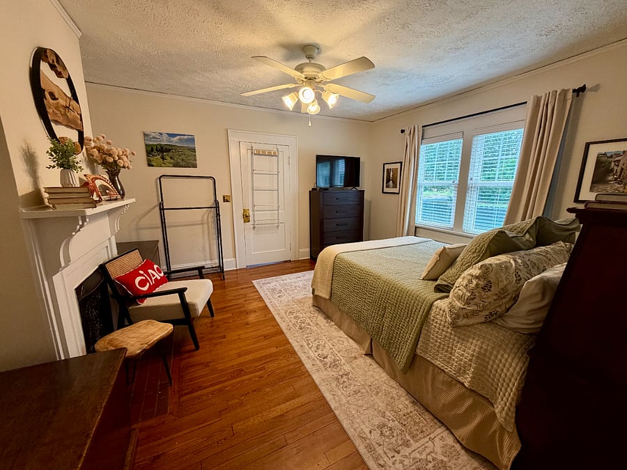 Smart TV and extra clothing rack space. Storage chests hold extra blankets and linens