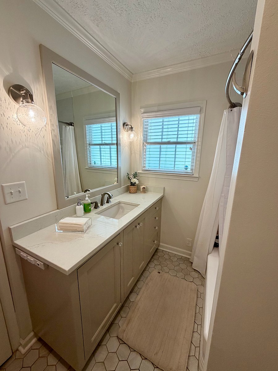 Primary Bathroom: Large vanity with ample storage and counter space.