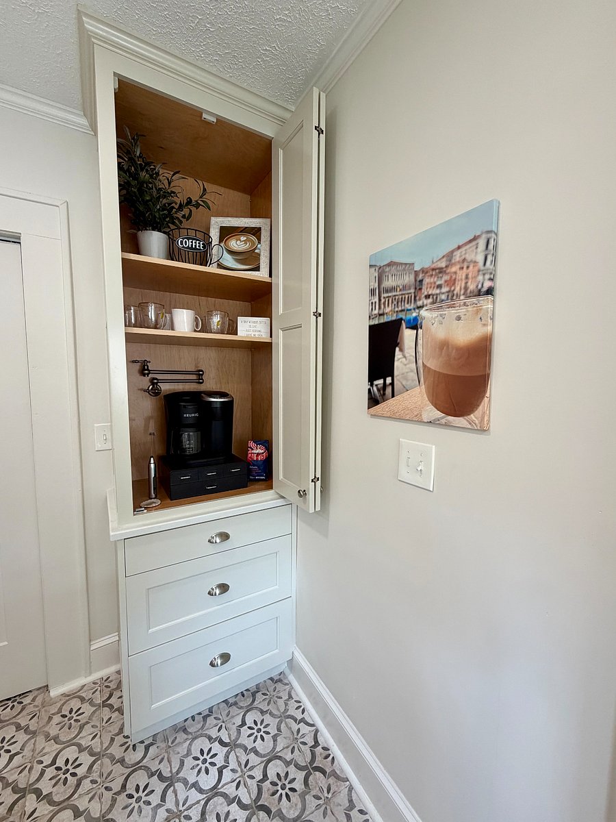 Dedicated coffee station stocked with mugs and brewing essentials. Full pot and Keurig options.