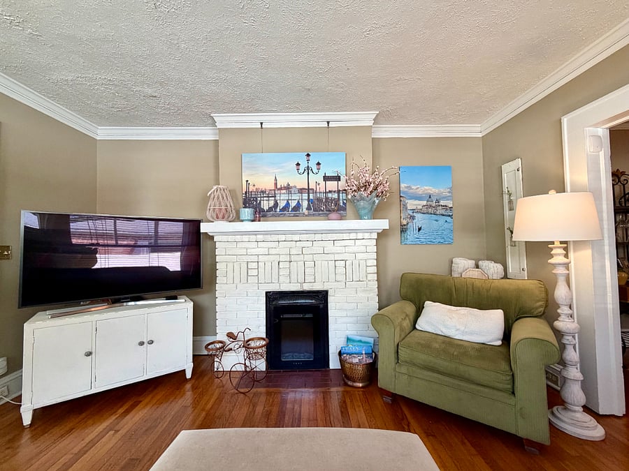 Decorative fireplace with electric heater and realistic flame effect for cozy winter evenings.