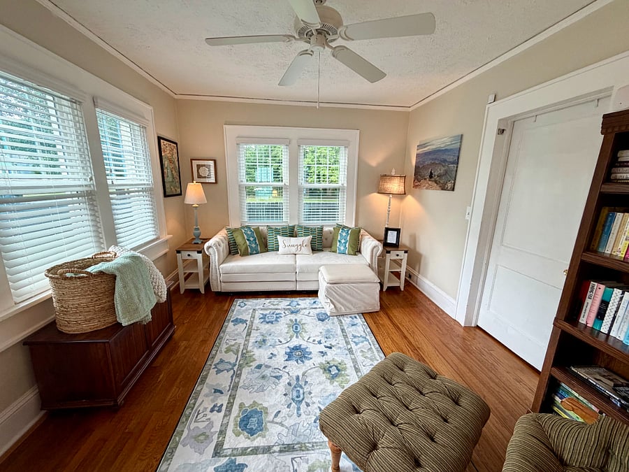 Sun room: Sofa for lounging or studying. Converts to King Bed