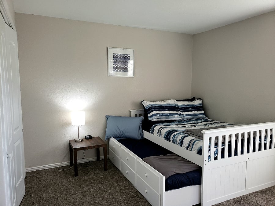 downstairs bedroom has a double bed with a twin trundle