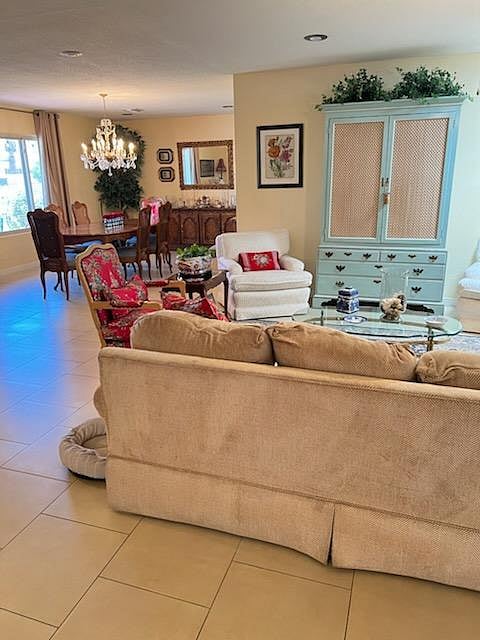 Another view of the living room with the large dining room in the background.
