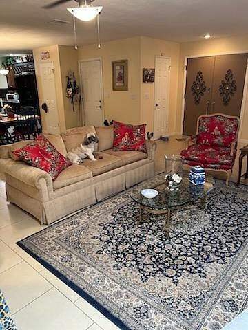 The main living room as you enter the home including little friendly Rascal to greet you!