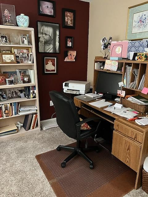 Private office workspace with desk and comfortable seating, ideal for remote work or studying.