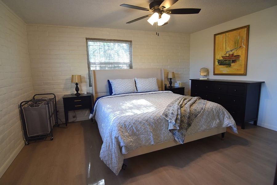Spacious Primary Bedroom with King Bed and Ample Storage for Clothing