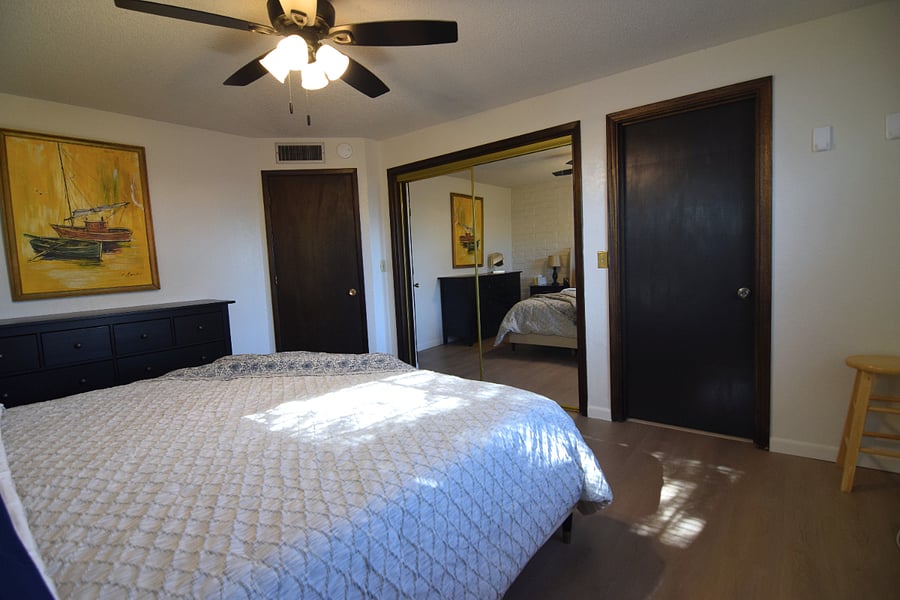 Spacious Primary Bedroom with King Bed and Ample Storage for Clothing