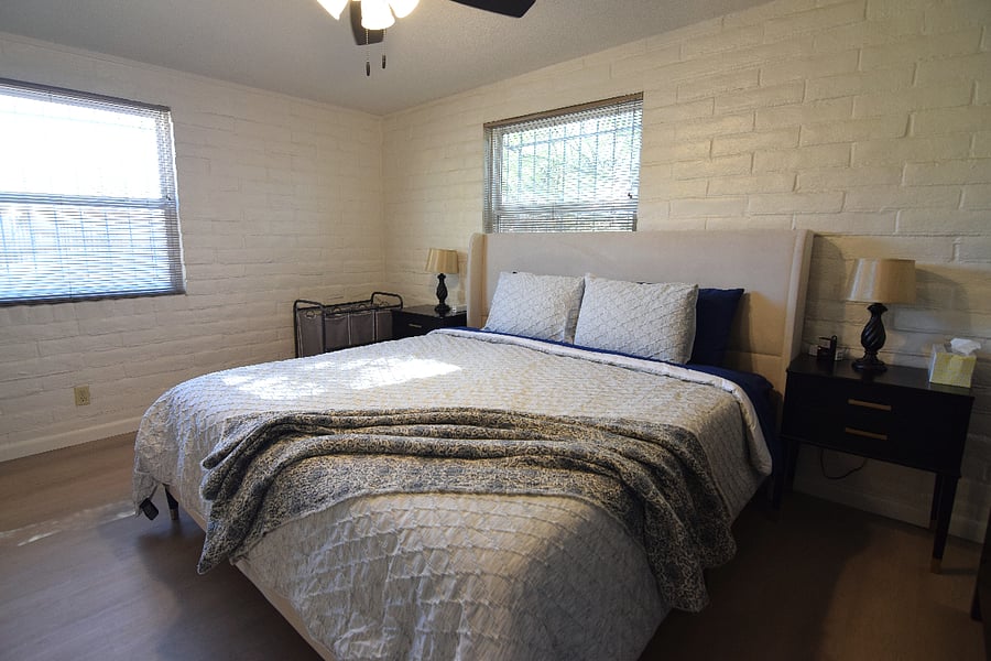 Spacious Primary Bedroom with King Bed and Ample Storage for Clothing