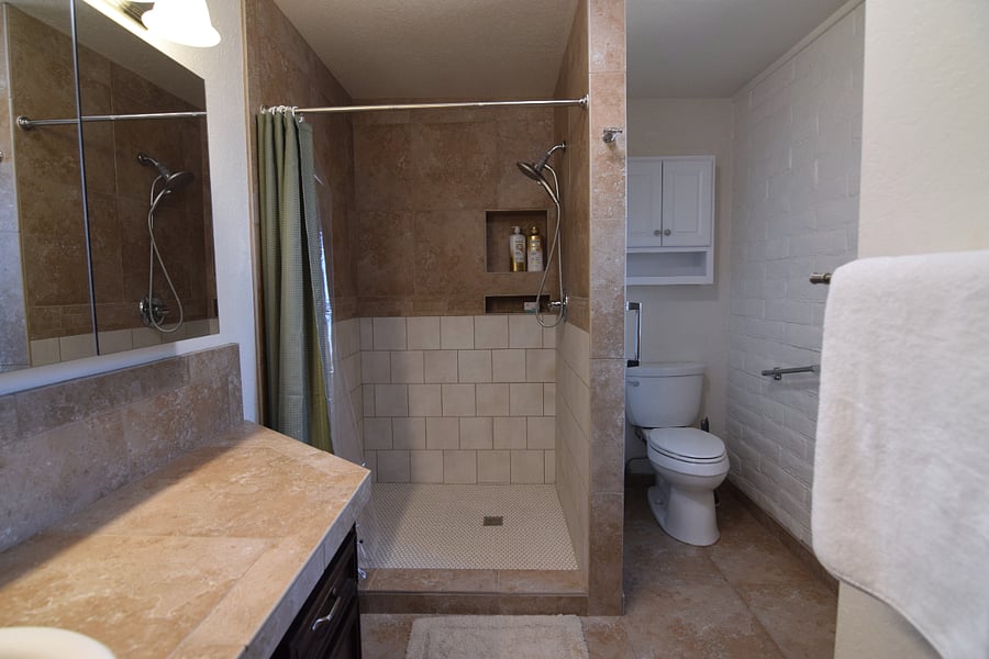 Primary Bathroom Featuring a Spacious Two-Person Shower and Additional Closet Space