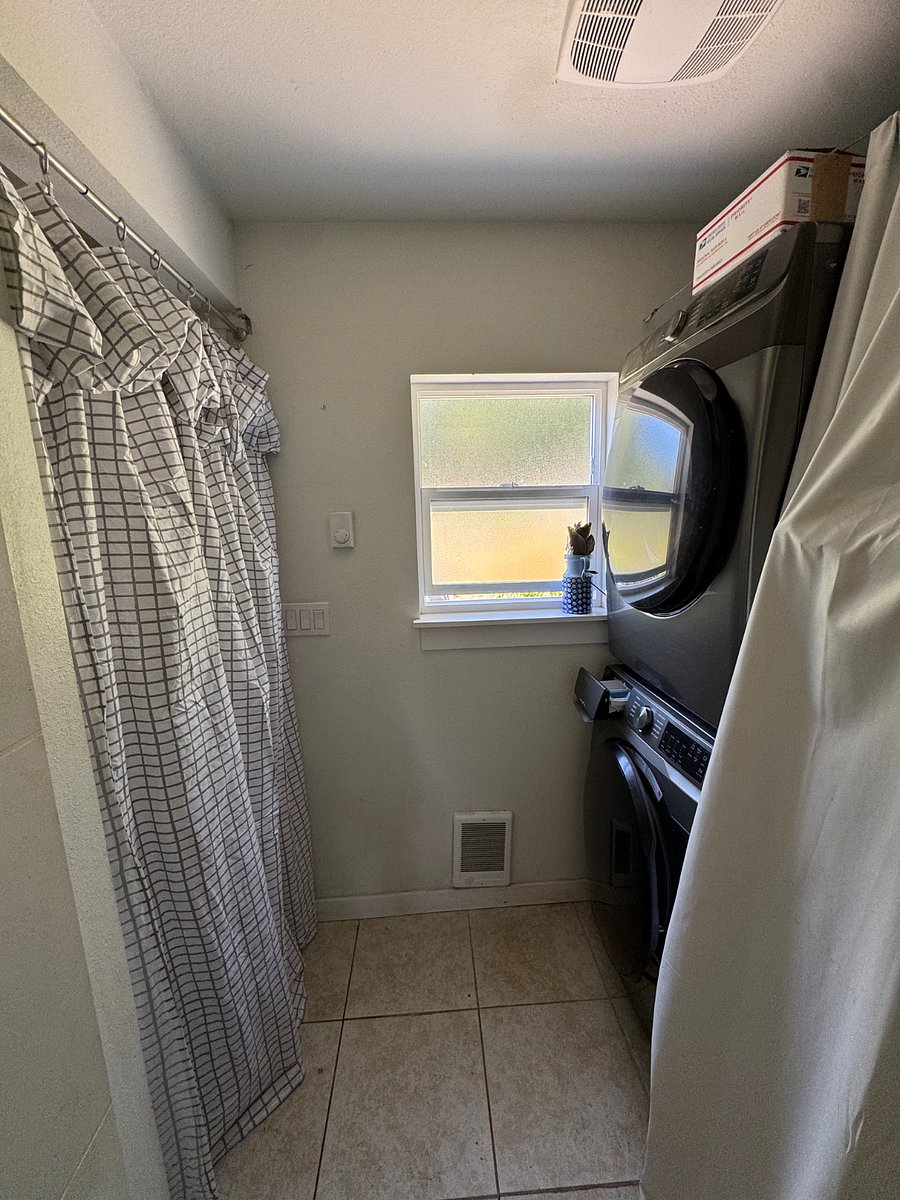 Laundry shared with tenant upstairs. You have a locking door between you and the shared laundry.