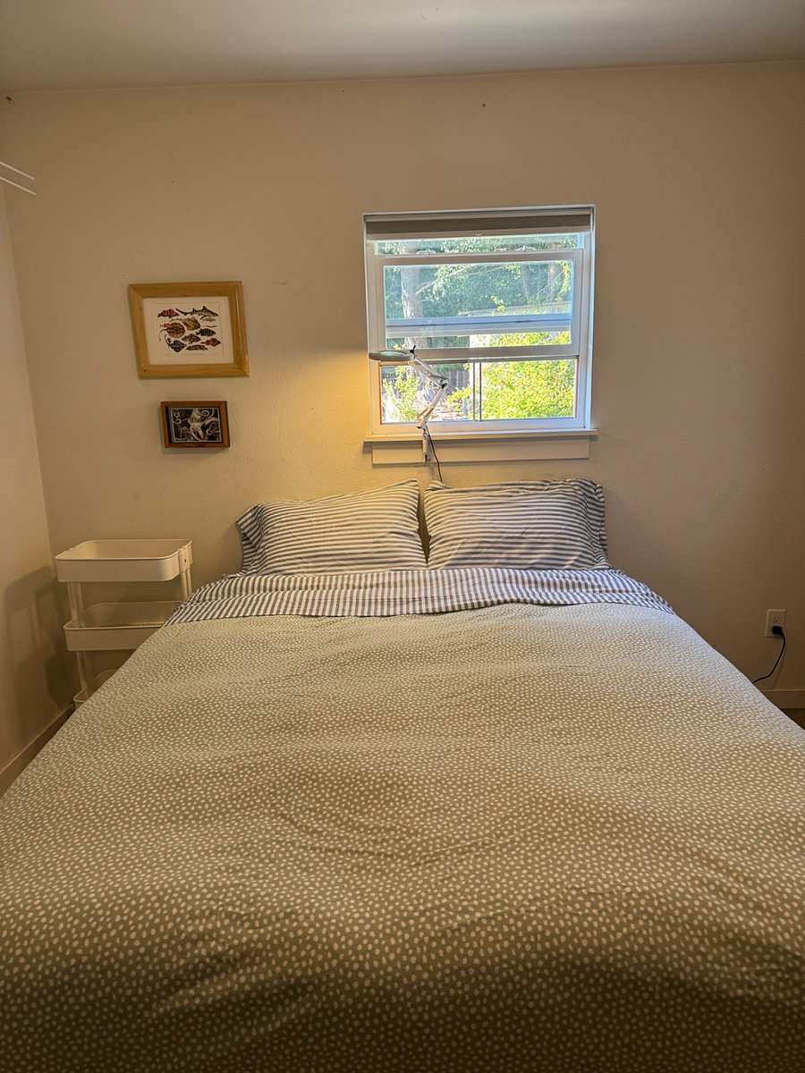 Queen bed with cozy down comforter and leather butterfly chair with sheepskin. Ample clothing storage in the closet and cabinet