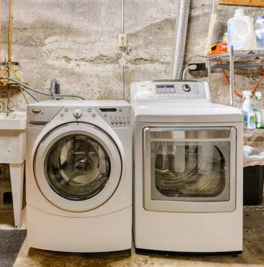 Washer and dryer in basement.