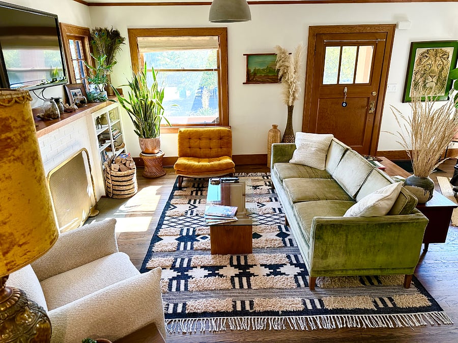 living room with Roku tv, fireplace and plenty of seating.Home has central air on main floor and mini splits upstairs.
