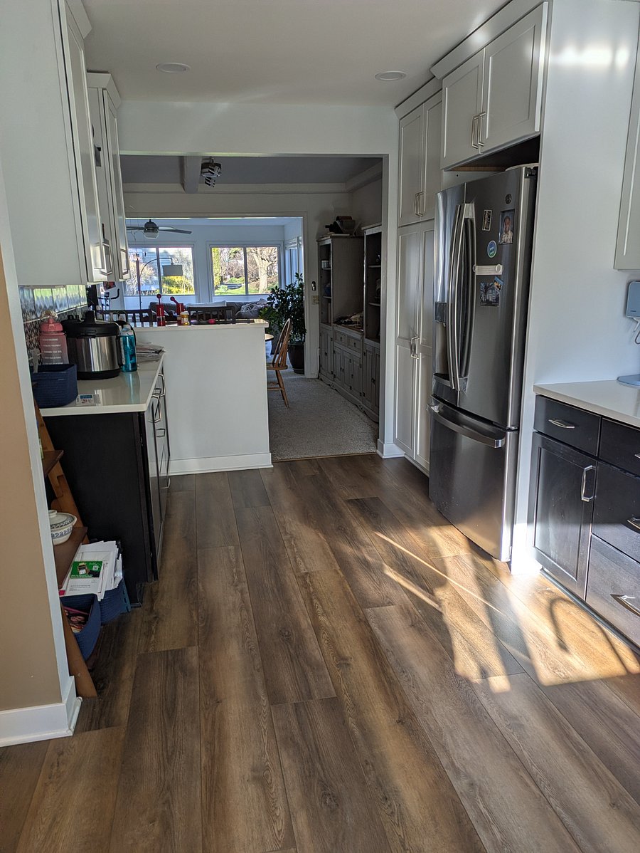 Breakfast bar between the kitchen and dining room increases the light and flow.