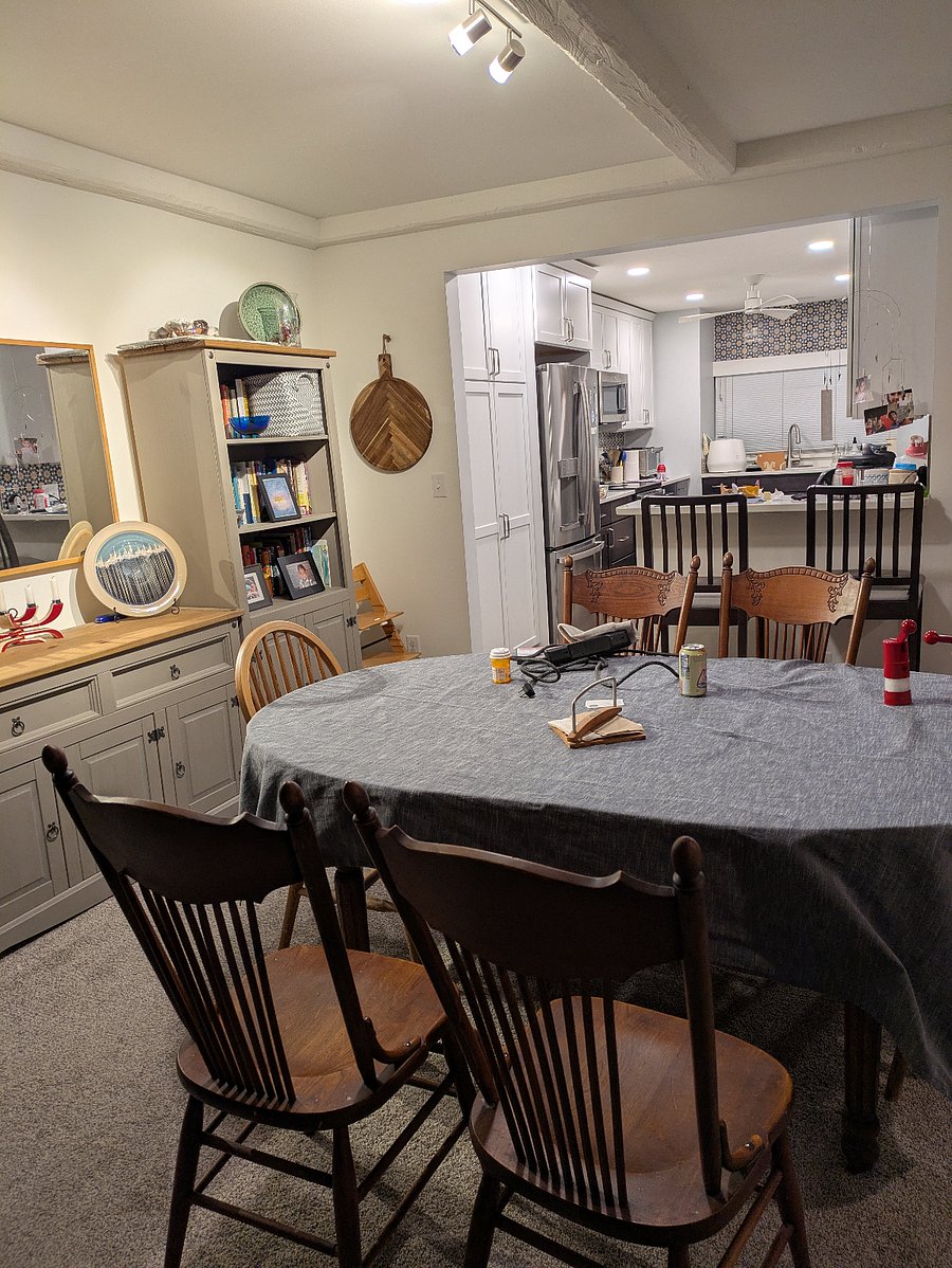 Dining room with shelving. Furnishings may vary as we are in process of moving out and preparing the rental.