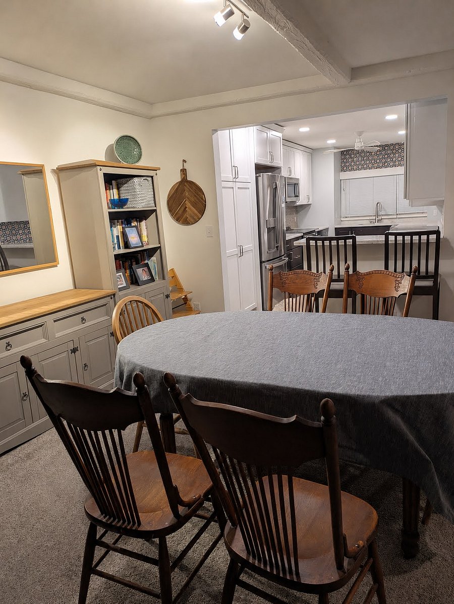 Dining room with shelving. Furnishings may vary as we are in process of moving out and preparing the rental.