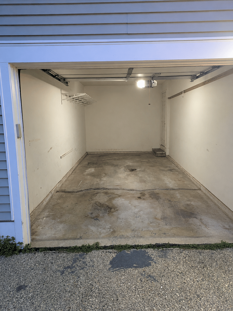 Long, narrow, one-car attached garage.